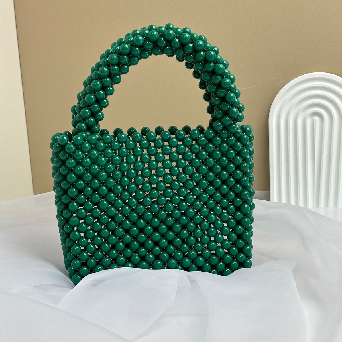 Eprolo beaded handbag in solid color with intricate beadwork, stylish and compact for fashionable accessories.