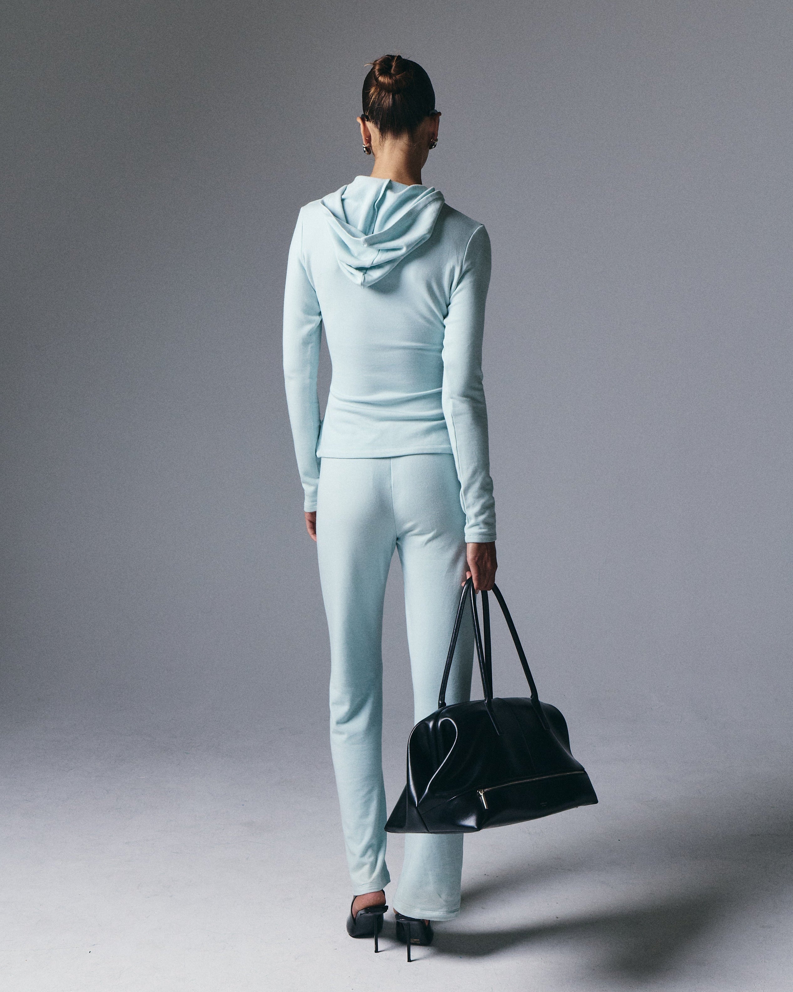 Artless Forever Leni Hooded Top in soft fabric, shown in a casual fit with hood and long sleeves on a neutral background.