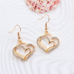 Double heart earrings and necklace wedding jewelry set featuring silver-tone hearts and delicate chain details.