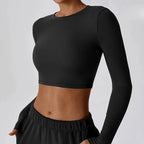 Women's slim fit long sleeve yoga top by Plush Fashion Hub, featuring a comfortable activewear design in a sleek, modern style.