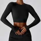 Women's slim fit long sleeve yoga top from Plush Fashion Hub, activewear, with a fitted design and soft fabric in a neutral color.