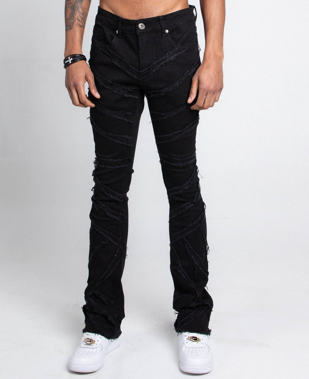 Pair of ARMOR JEANS AJS410 shredded stacked jeans showing distressed design and slim fit style.