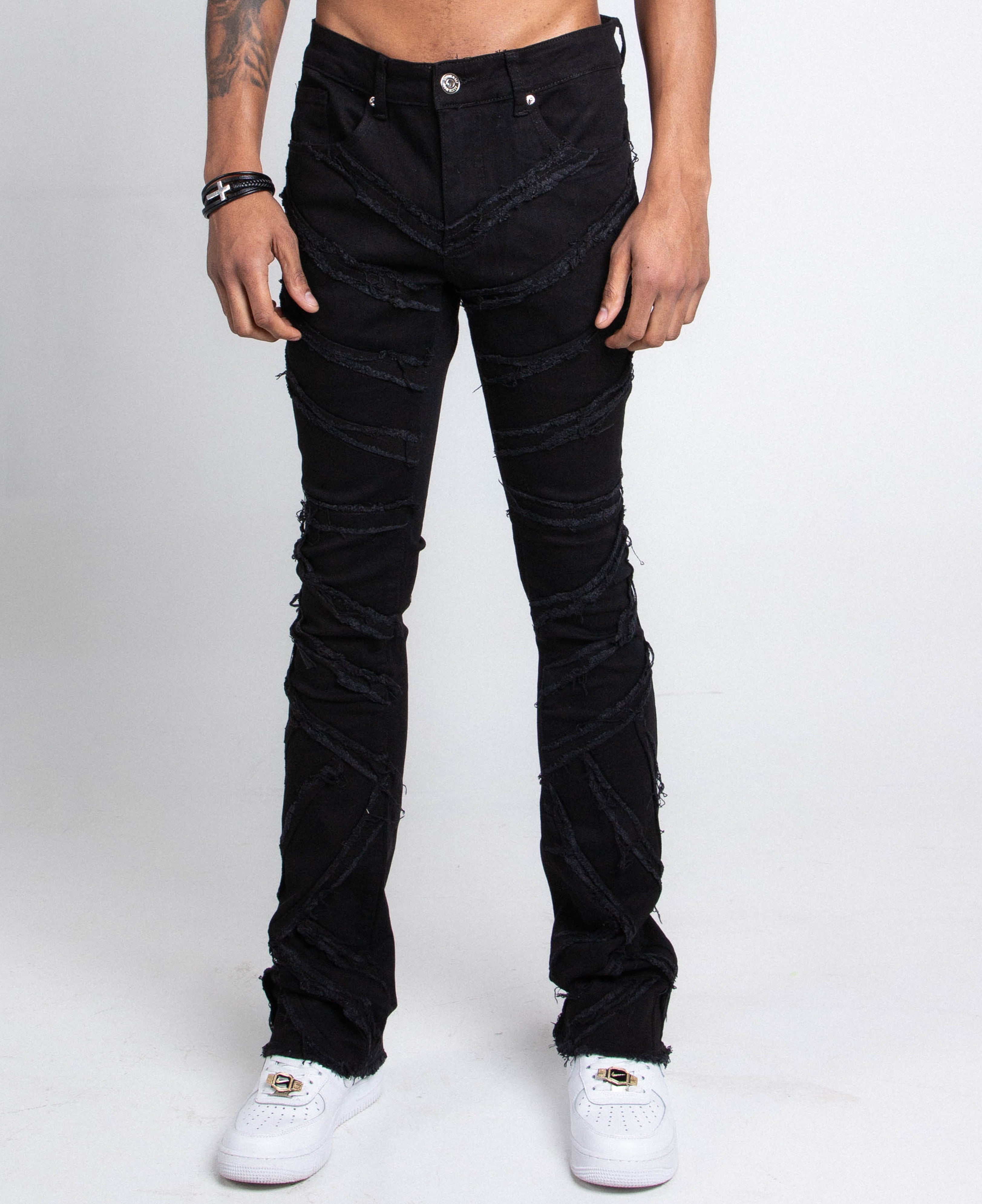 Pair of ARMOR JEANS AJS410 shredded stacked jeans showing distressed design and slim fit style.