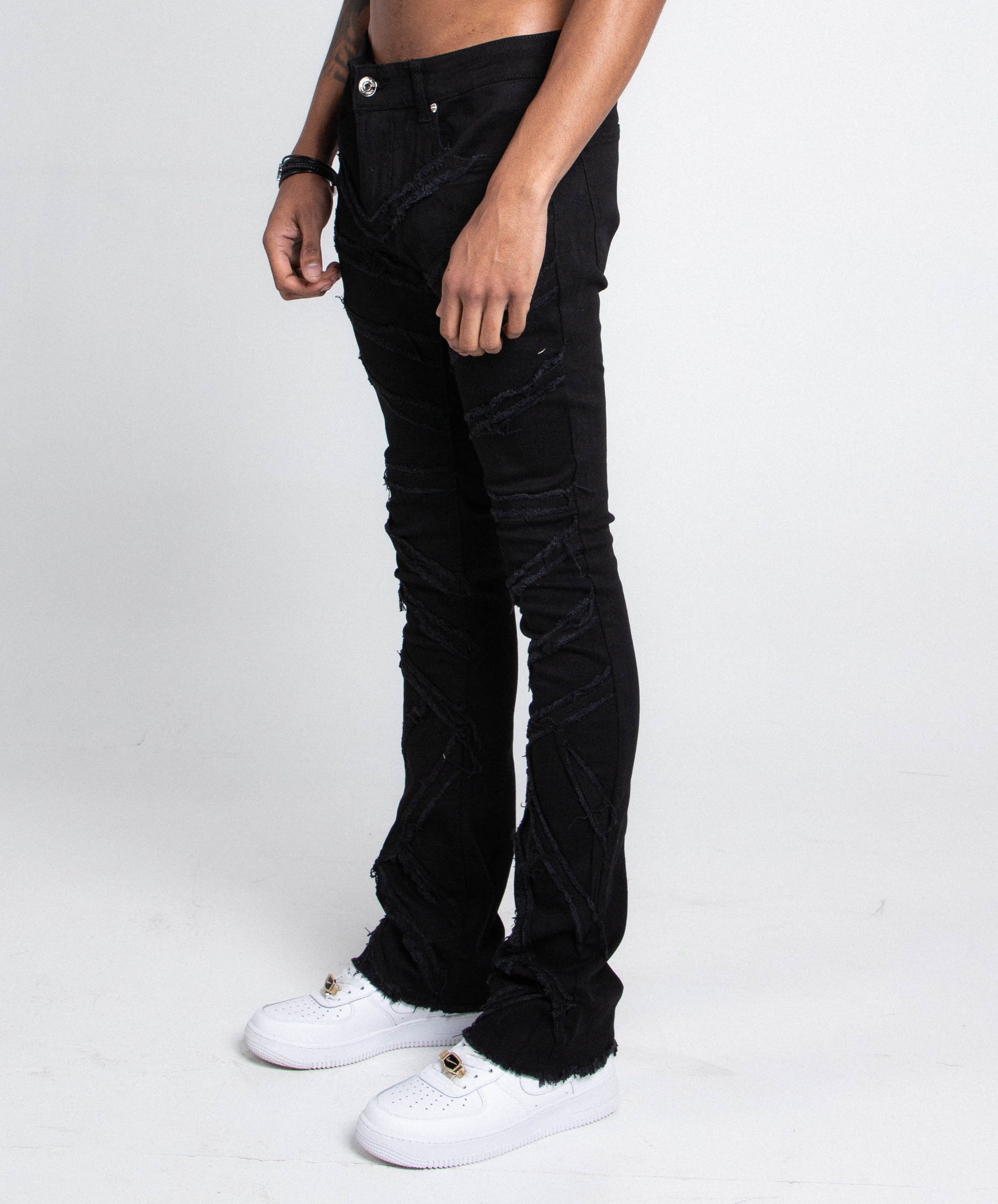 Pair of Armor Jeans AJS410 shredded stacked jeans pants with distressed detailing and a modern fit.