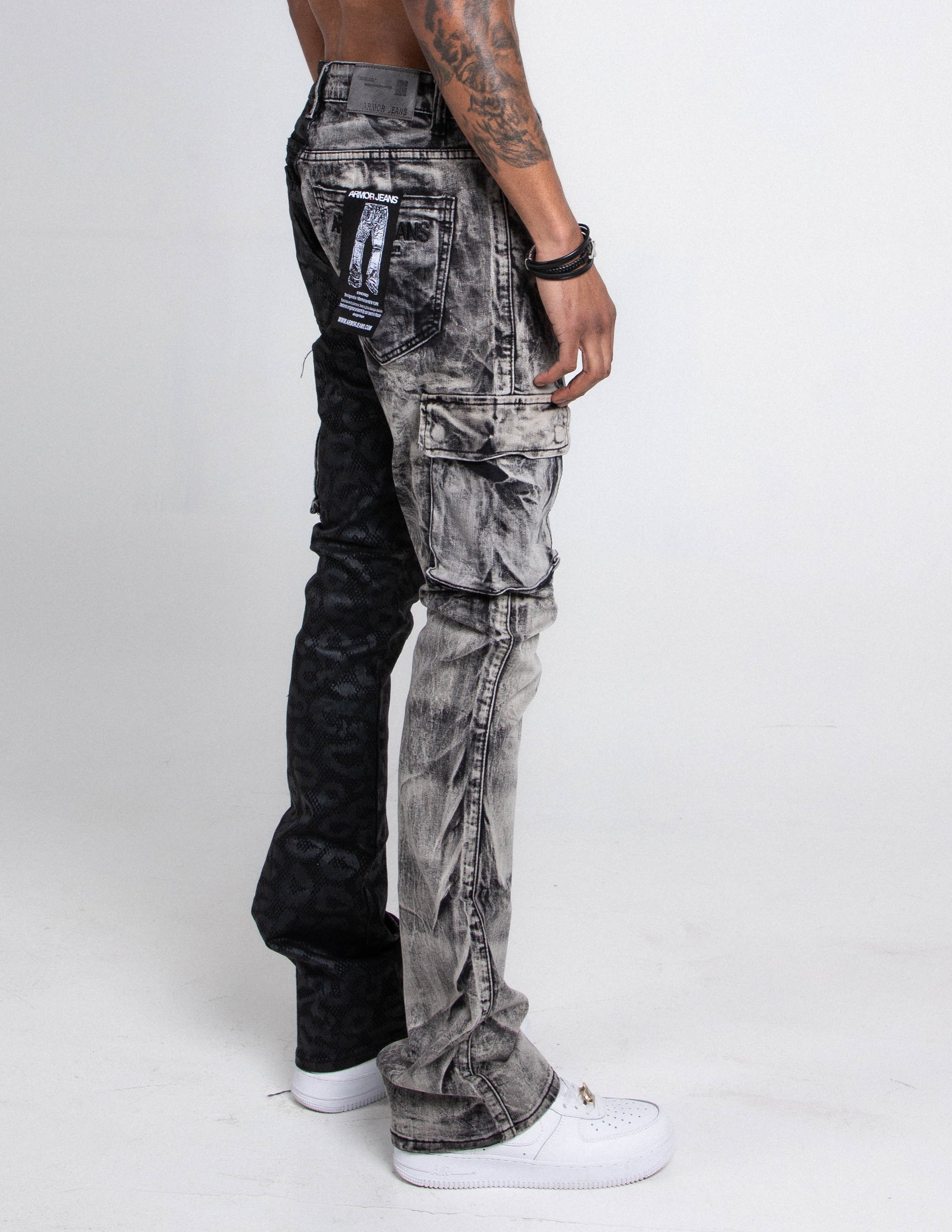 Black lace stacked jeans by Armor Jeans featuring a fitted style and layered lace detailing on the legs.
