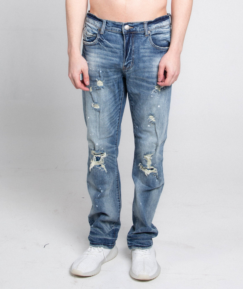 Distressed casual skinny jeans by Armor Jeans featuring ripped details and a fitted style, shown in a front view.