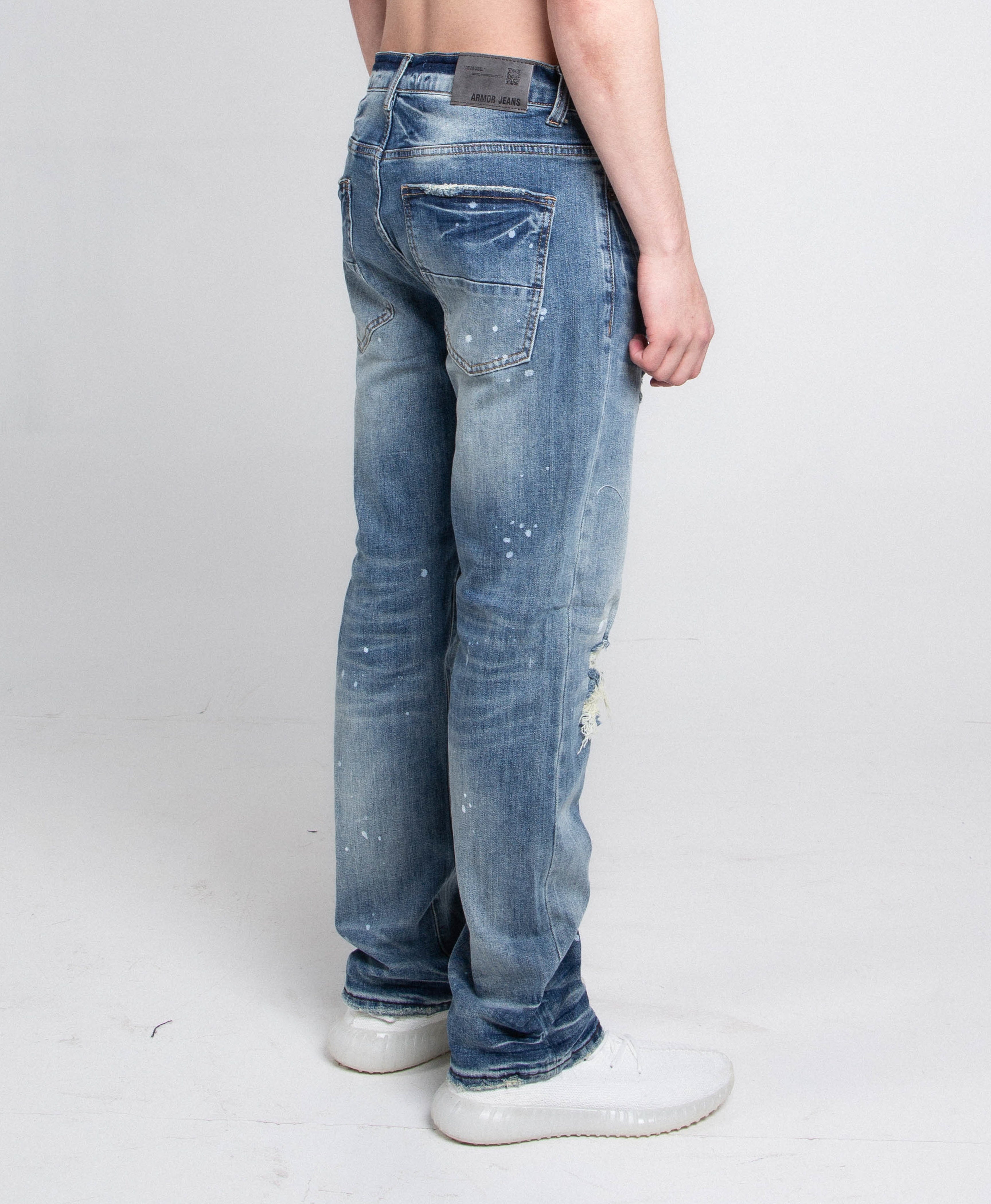 Pair of ARMOR JEANS AJ05C casual skinny distressed jeans with ripped details and a fitted style, shown in a full-length view.