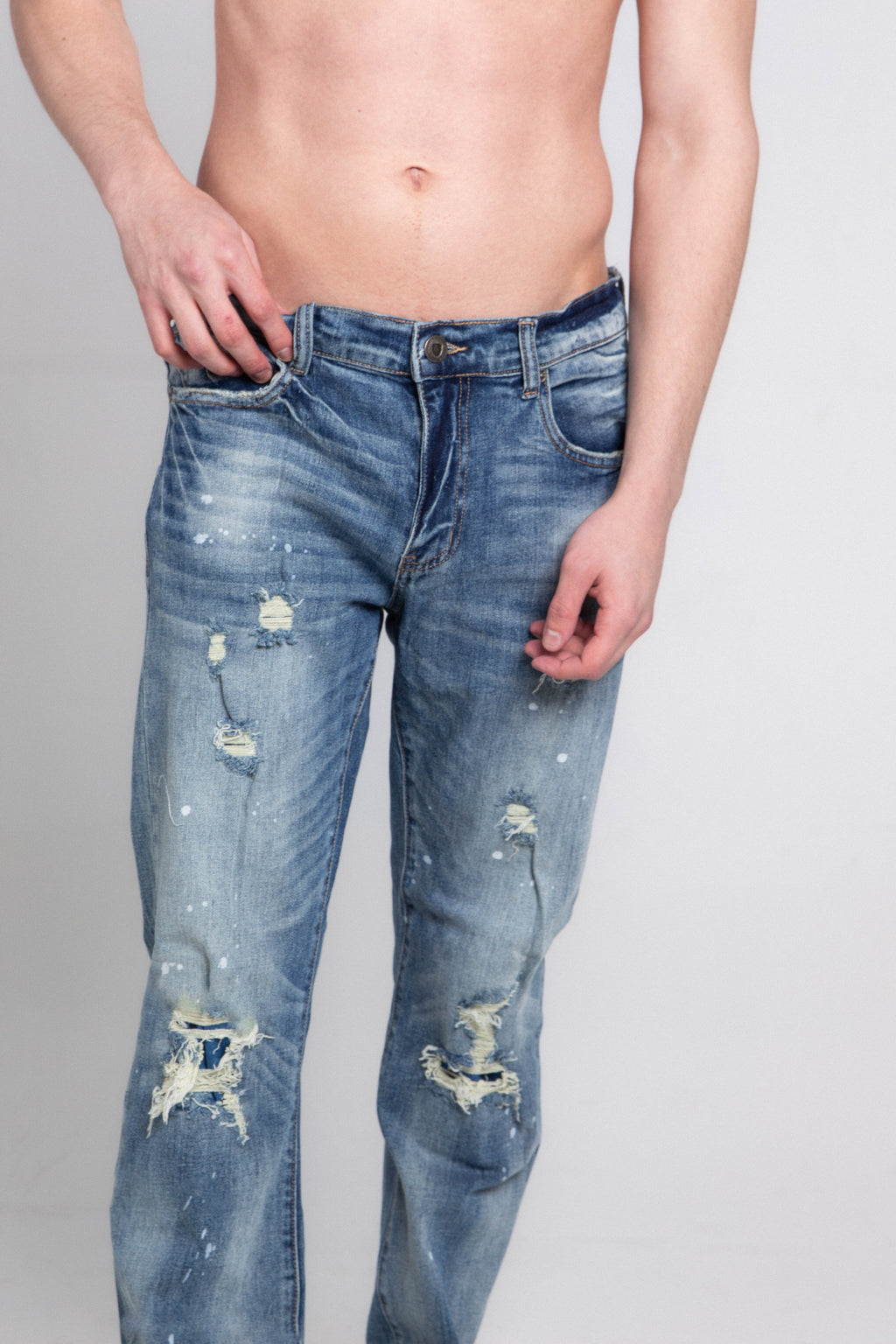 Dark gray casual skinny distressed jeans from Armor Jeans, showing front view with rips and fading details.