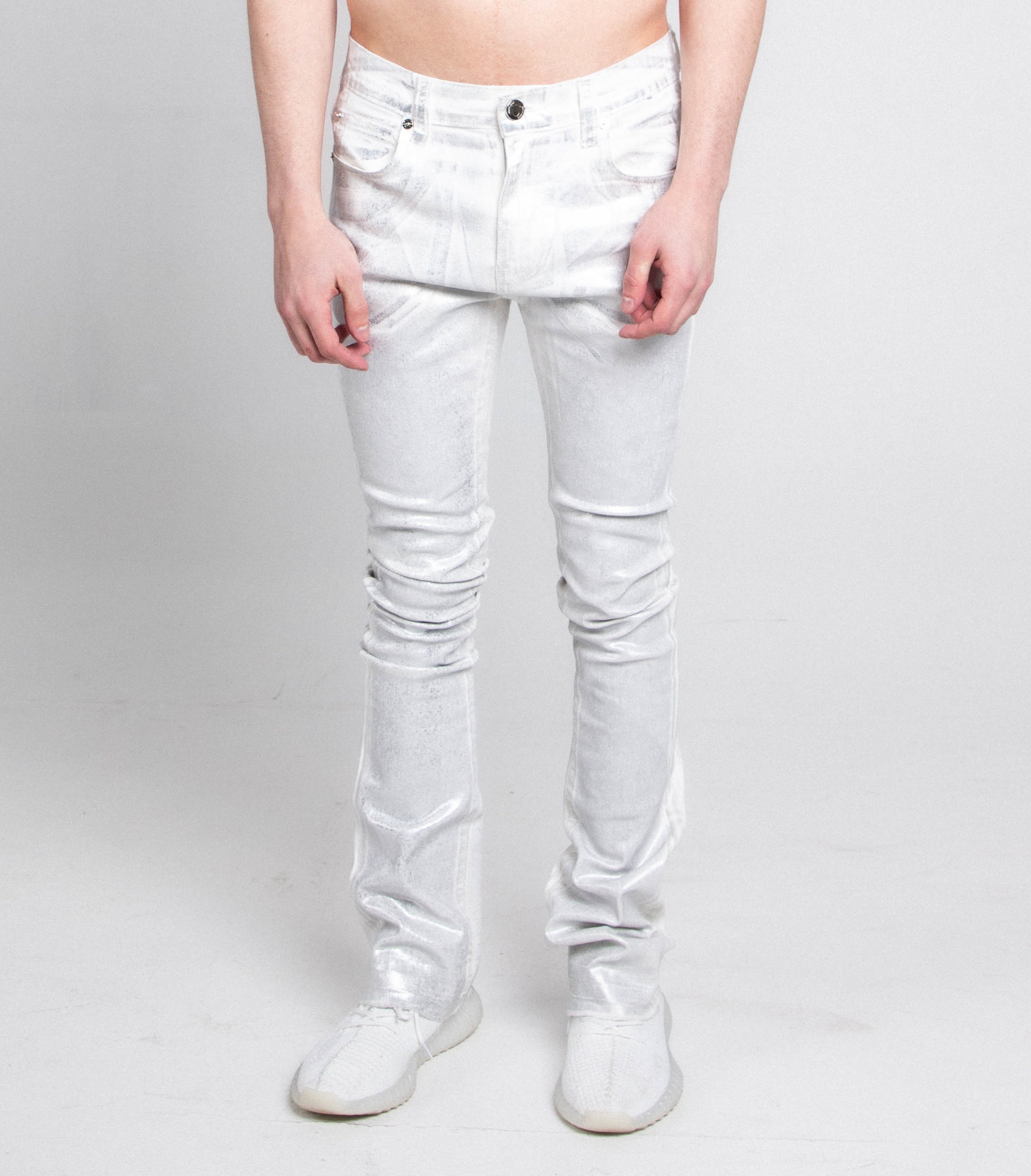 Stacked blue Armor Jeans ASJ691 Silhouettes pants with a relaxed fit, shown hanging on a wooden hanger.