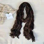 Women's vintage floral cotton linen scarf featuring retro print, soft breathable fabric, ideal for stylish wrap or accessory.