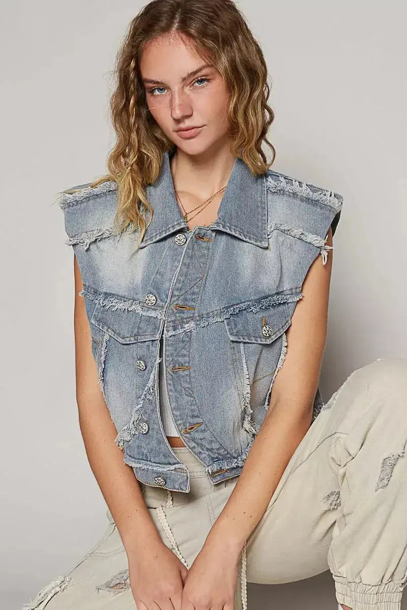 Asymmetrical distressed denim vest with raw hem, sleeveless jean jacket by Trendsi, featuring a stylish, rugged design.