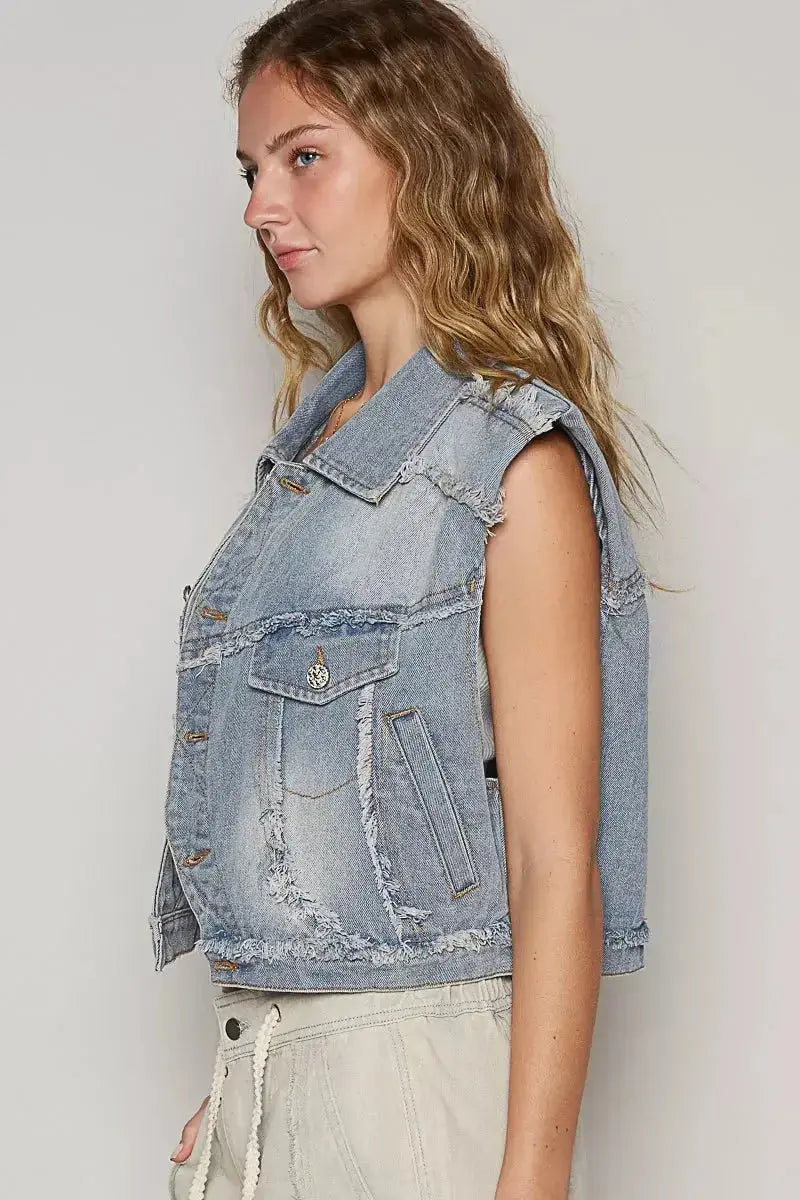 Asymmetrical distressed denim vest with raw hem, sleeveless jean jacket by Trendsi, casual and edgy fashion piece.