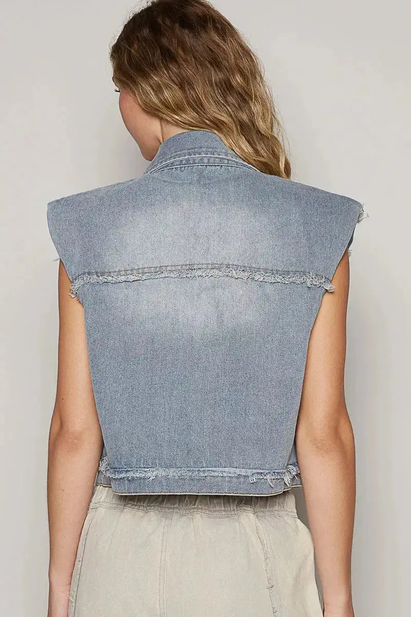 Asymmetrical distressed denim vest with raw hem, sleeveless jean jacket by Trendsi, casual fashion statement.