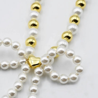 Audrey Bow gold and pearl necklace -clearance - Plush Fashion Hub