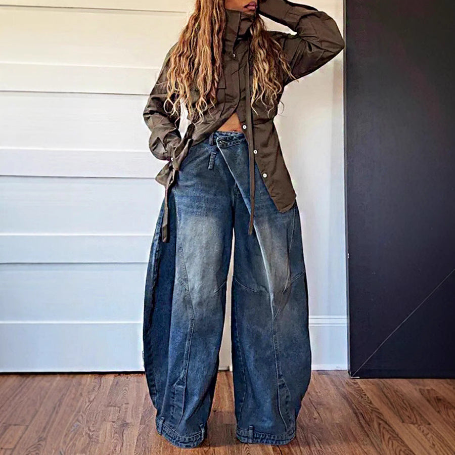 Distressed washed reversed waist women’s jeans by Plush Fashion Hub, featuring a vintage, faded denim style with a relaxed fit.