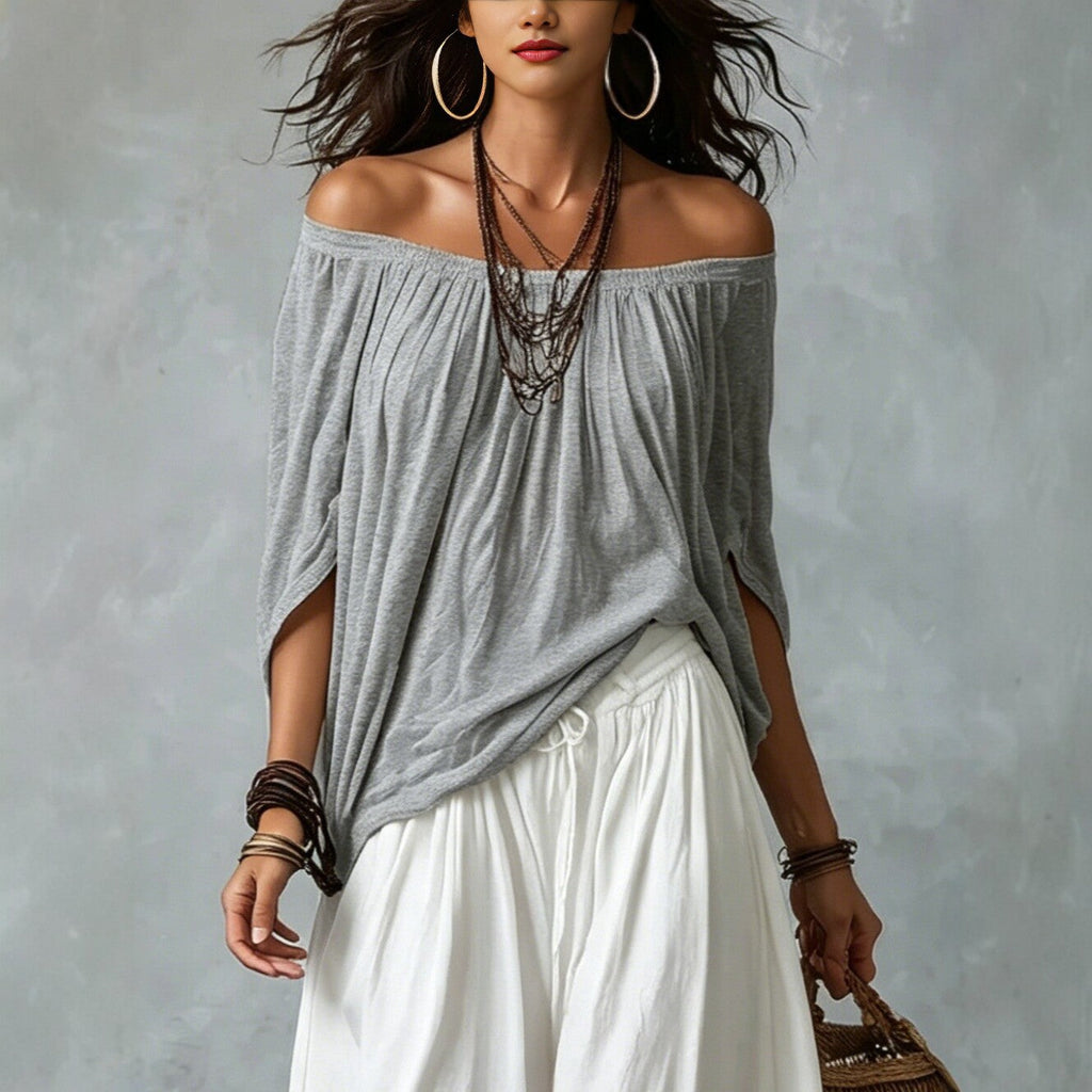 Women's one-shoulder T-shirt and wide-leg pants two-piece set by FitiqueFit, casual urban outfit, shown on a model.