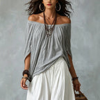 Women's one-shoulder T-shirt and wide-leg pants two-piece set by FitiqueFit, casual urban outfit, shown on a model.