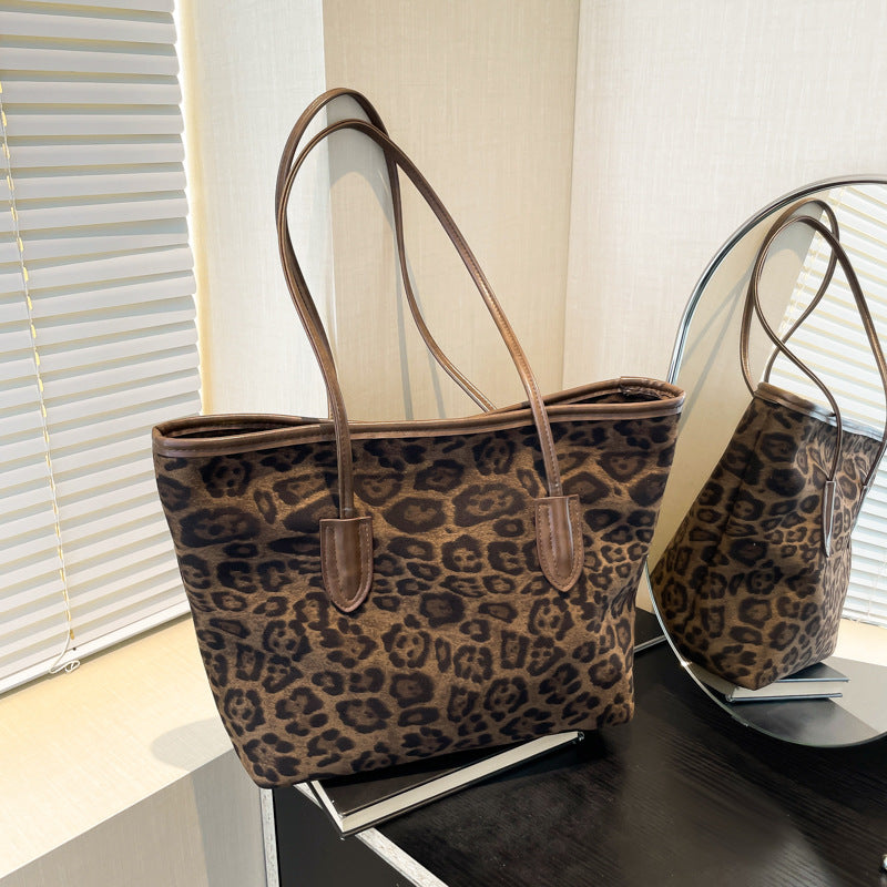 Large-capacity leopard-print PU leather shoulder and hand bag for women, stylish accessory by Plush Fashion Hub.