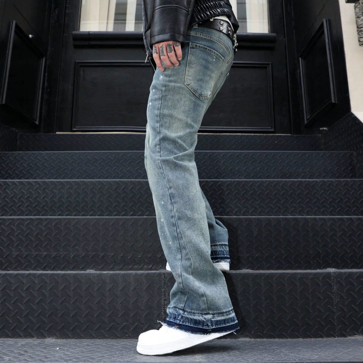 Blue denim jeans, distressed wash style, straight fit, white paint splatters, double layered frayed hem.