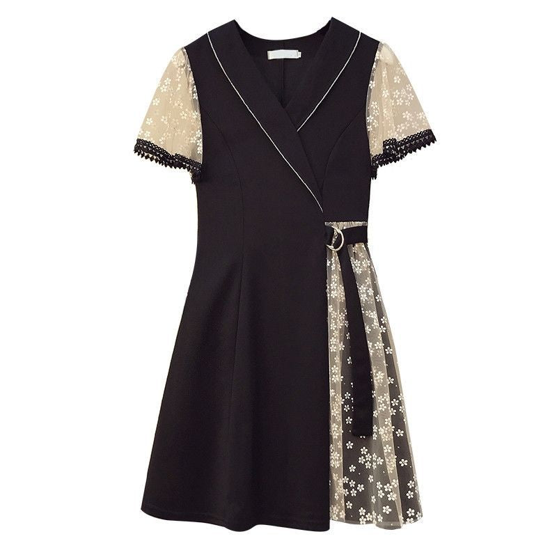Black mini dress with white piping, sheer floral sleeves, side belt, and a floral lace skirt insert.