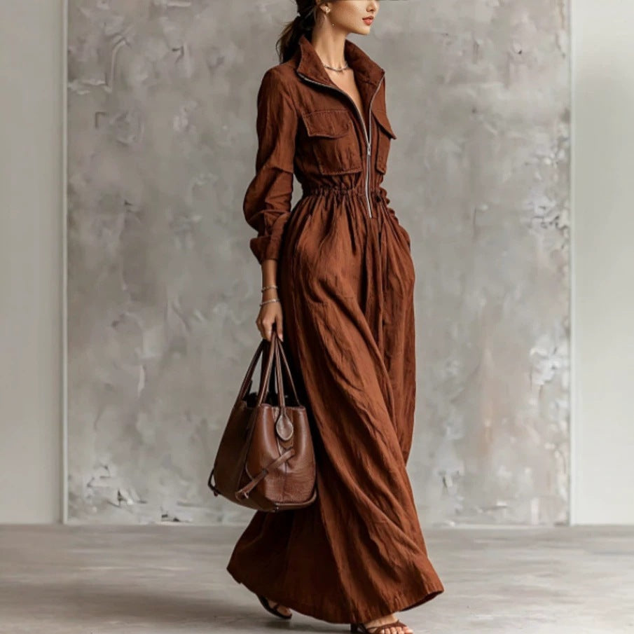 Women's long dress with zipper collar and elastic waist by eprolo, featuring a flowing fabric and stylish design.