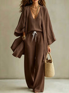 Women's 3-piece cardigan, sleeveless vest, and wide-leg pants matching set by Plush Fashion Hub, shown in a stylish, coordinated outfit.