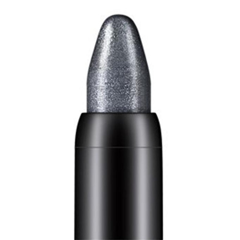 Close-up of a metallic grey eyeshadow crayon in a black casing.