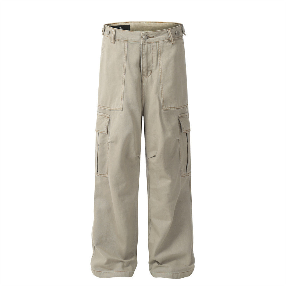 Beige cargo pants in cotton with a relaxed style, featuring side pockets and utility panels on the front.