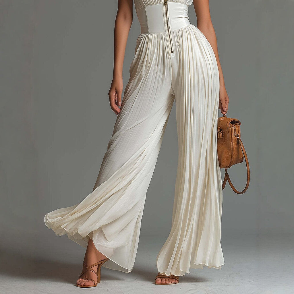 Sleeveless high-waist pleated wide-leg jumpsuit for women by FitiqueFit, featuring a minimalist long design with a stylish silhouette.
