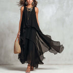 Black asymmetrical chiffon maxi dress by FitiqueFit featuring a flowy, sleeveless boho A-line design for women.