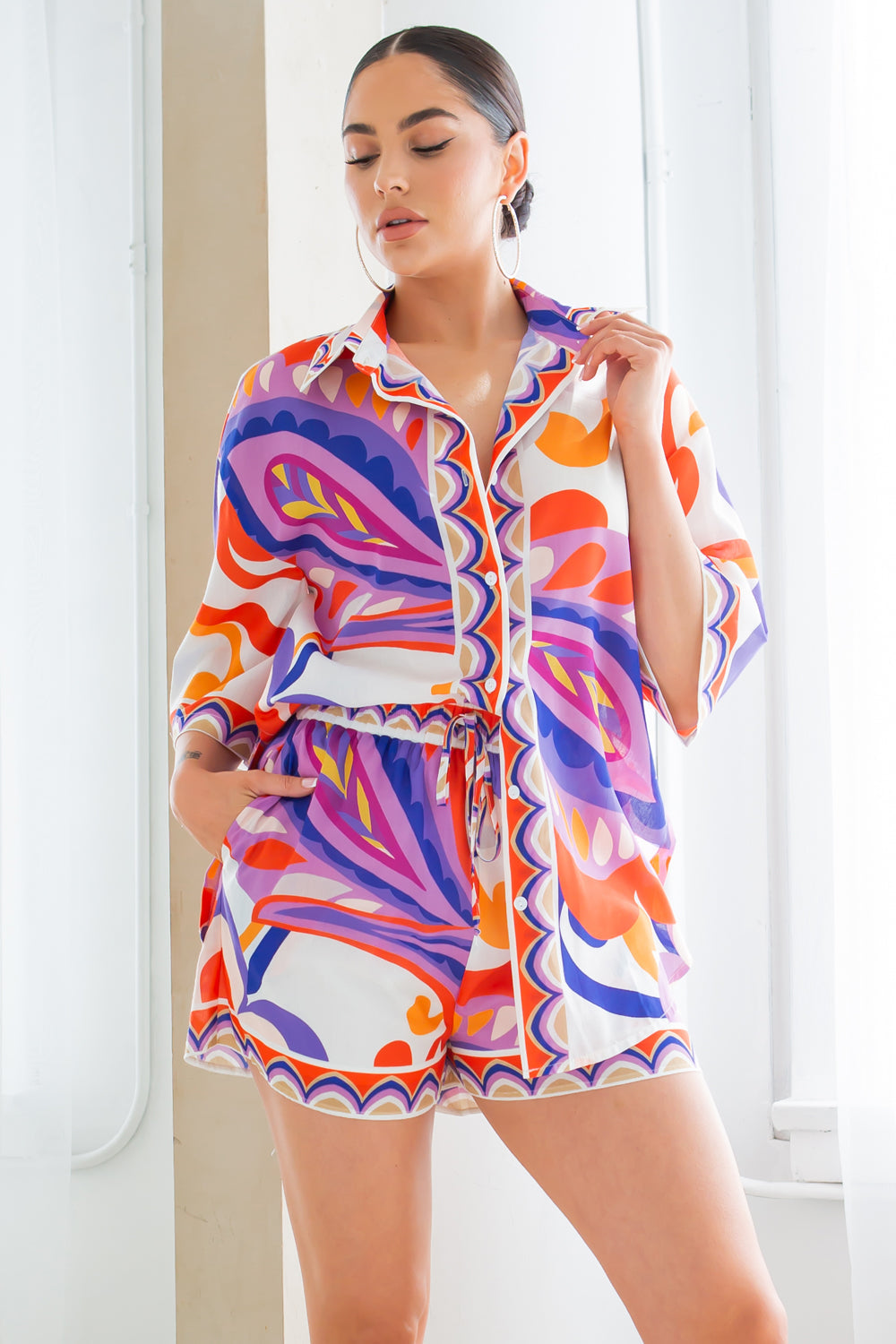 Fasheabe Joanna Short Set in vibrant orange, featuring a stylish matching top and shorts for a casual, trendy look.