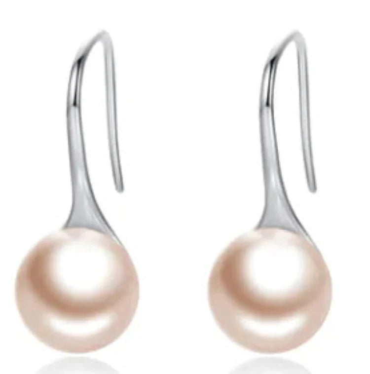 Silver shell stud pearl earrings for women with a polished finish, featuring elegant shell and pearl details.