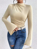 Plush Fashion Hub mock neck fitted top with ruched design and bell sleeves, stylish and comfortable for casual wear.
