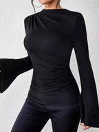 Plush Fashion Hub mock neck fitted top with ruched detailing and bell sleeves, showcasing a stylish and elegant design.
