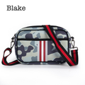 Black neoprene crossbody bag by Threaded Pear featuring adjustable strap and minimalist design for everyday use.