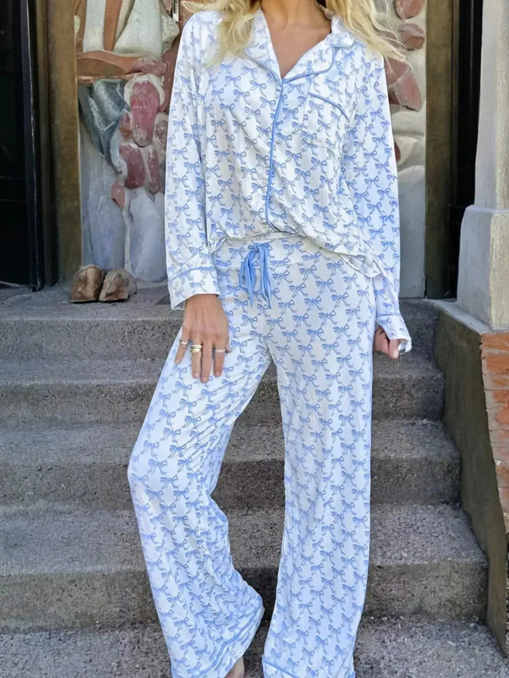 Women’s bow print long sleeve pajama set by Plush Fashion Hub featuring a button-down top and matching pants for soft loungewear.