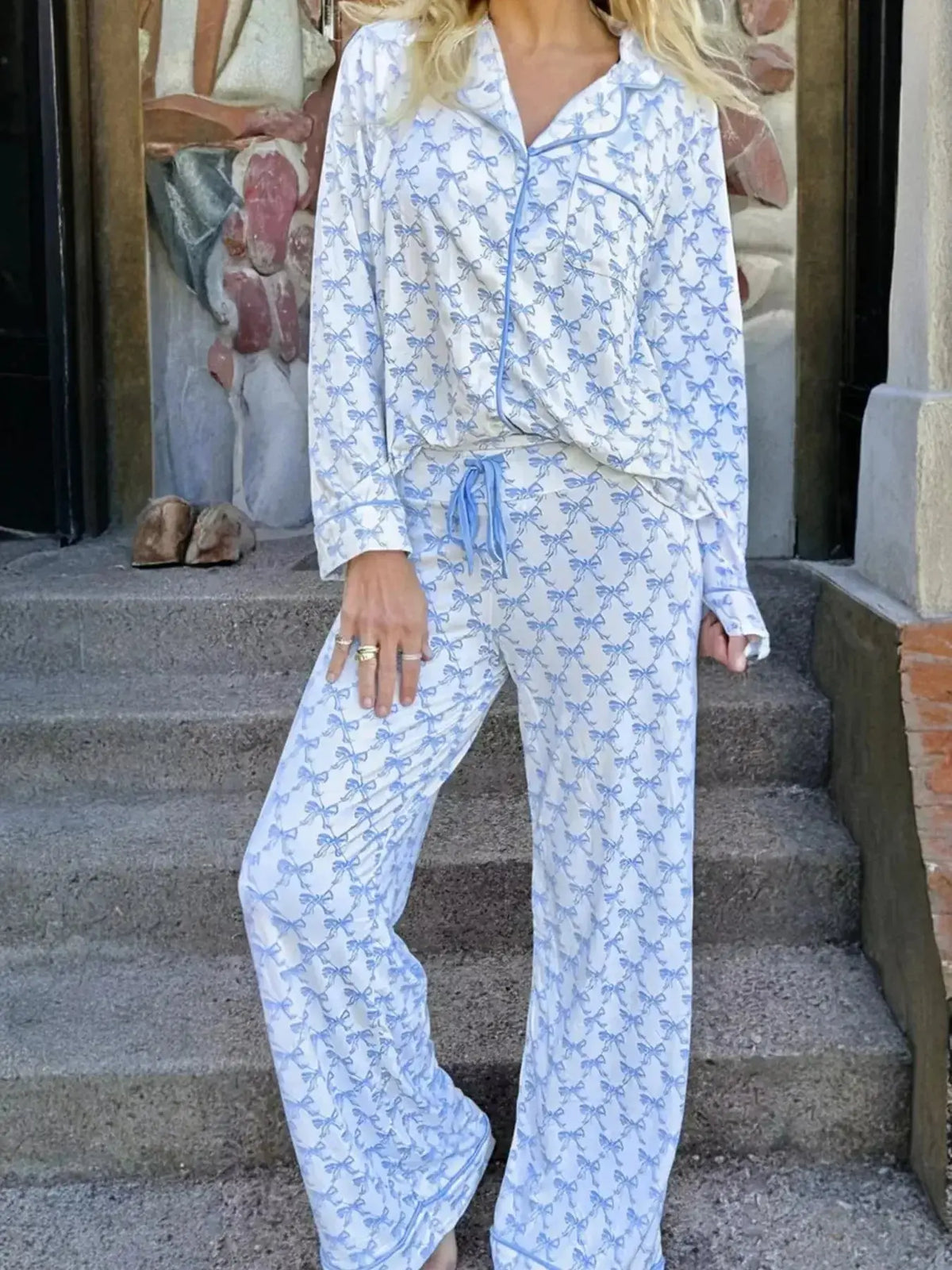 Women's bow print long sleeve pajama set with button-down shirt and pants by Plush Fashion Hub, soft and comfortable sleepwear.