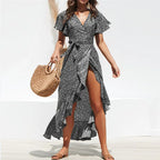 Women’s summer floral high-waist chiffon dress with V-neck, flowing fabric, perfect for warm-weather occasions.