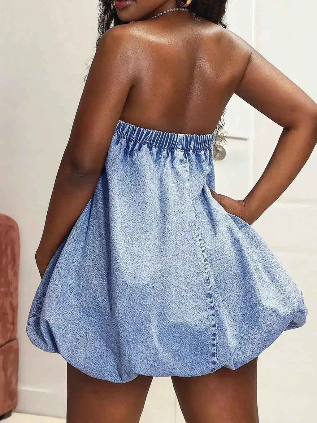 Blue denim bubble hem strapless mini tube dress by Trendsi, perfect for casual summer style, shown on a model.