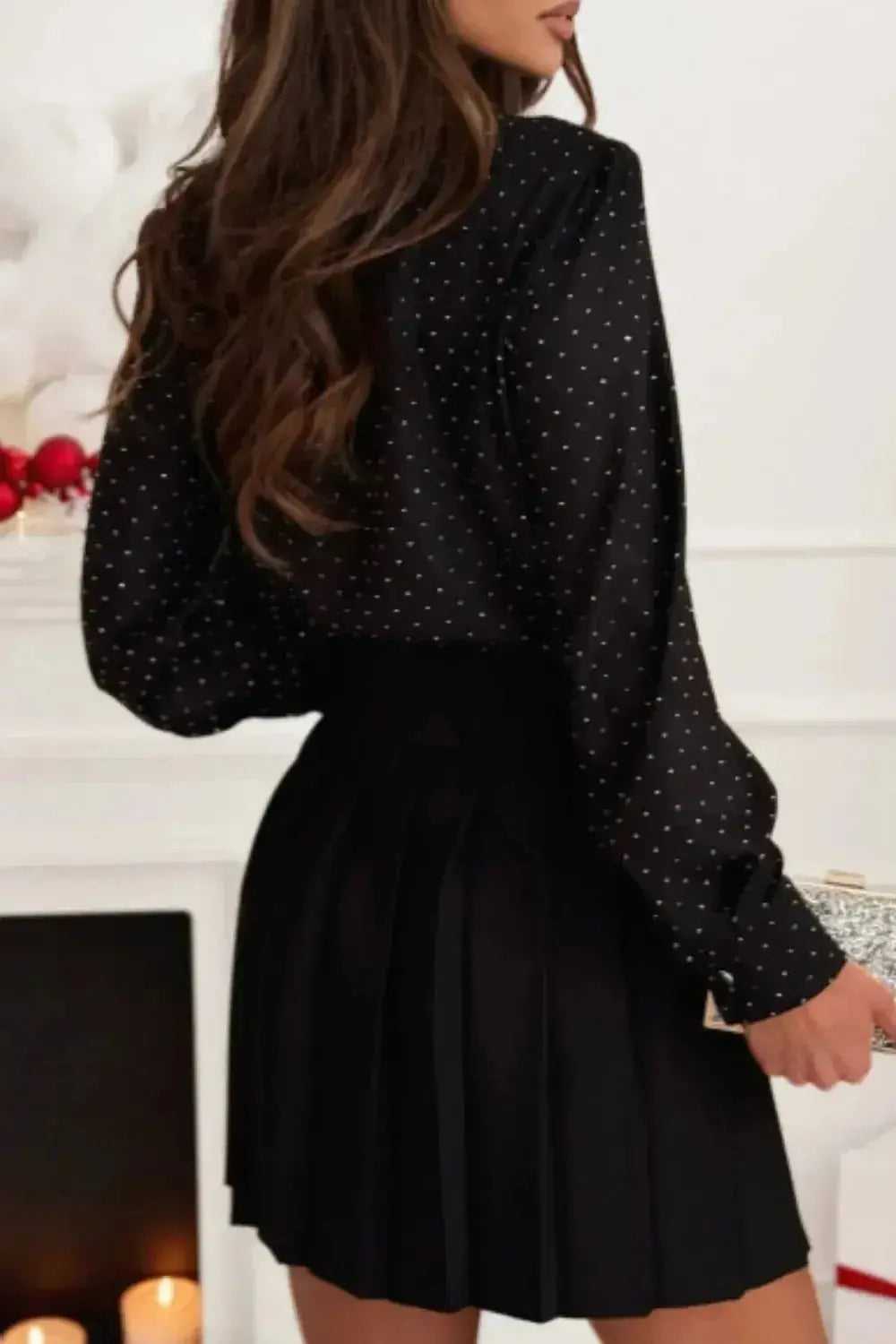 Women's rhinestone button-down long sleeve shirt by Plush Fashion Hub with sparkling rhinestone details and classic collar.