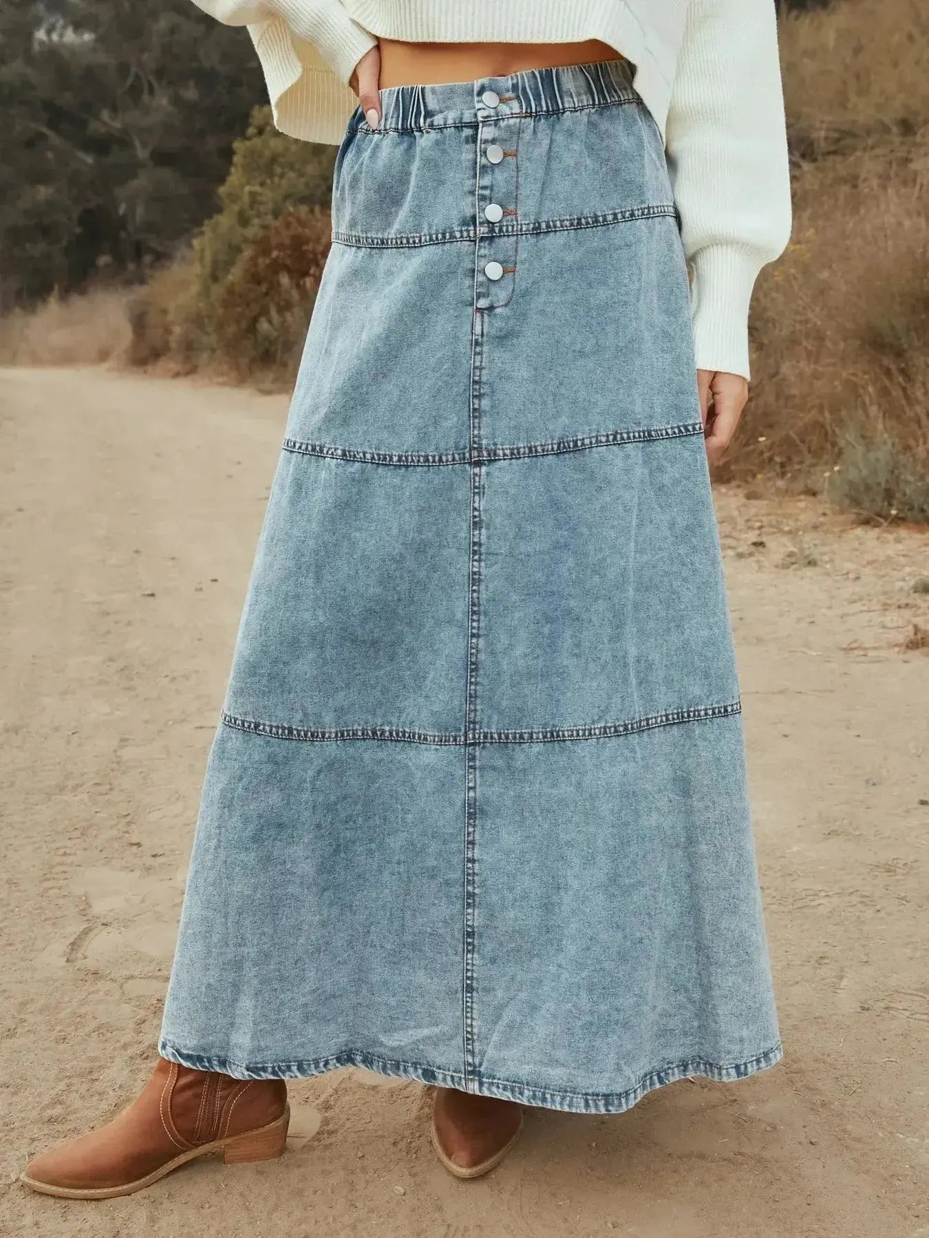 Flowy casual long denim maxi skirt with button-front tiers by Trendsi, featuring a relaxed, flowing silhouette and chic denim fabric.