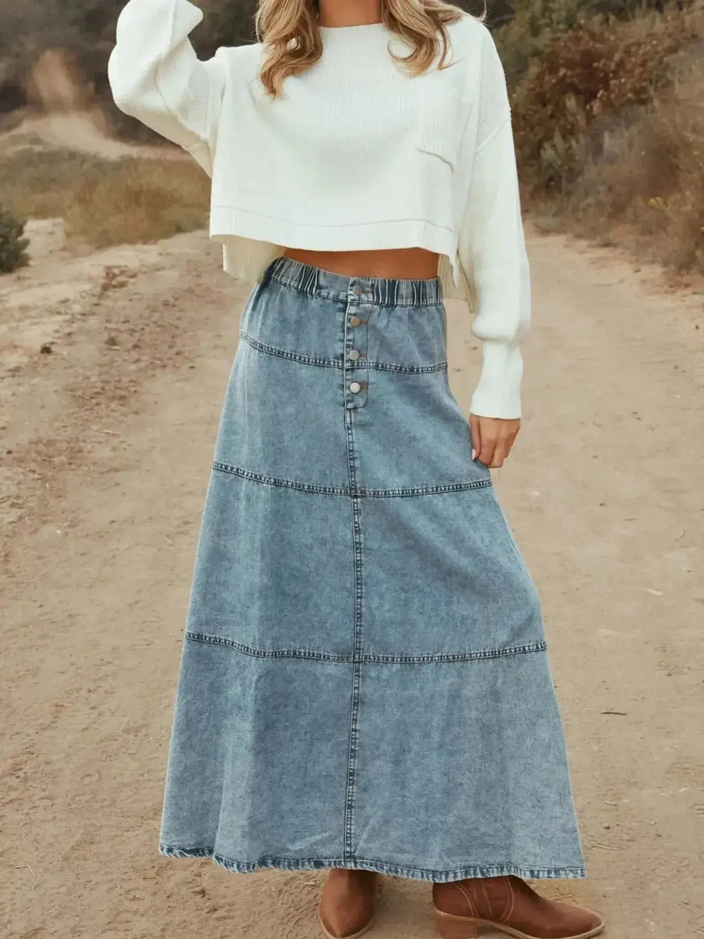 Flowy casual long denim maxi skirt with button-front tiers by Trendsi, featuring a relaxed, flowing silhouette and casual style.