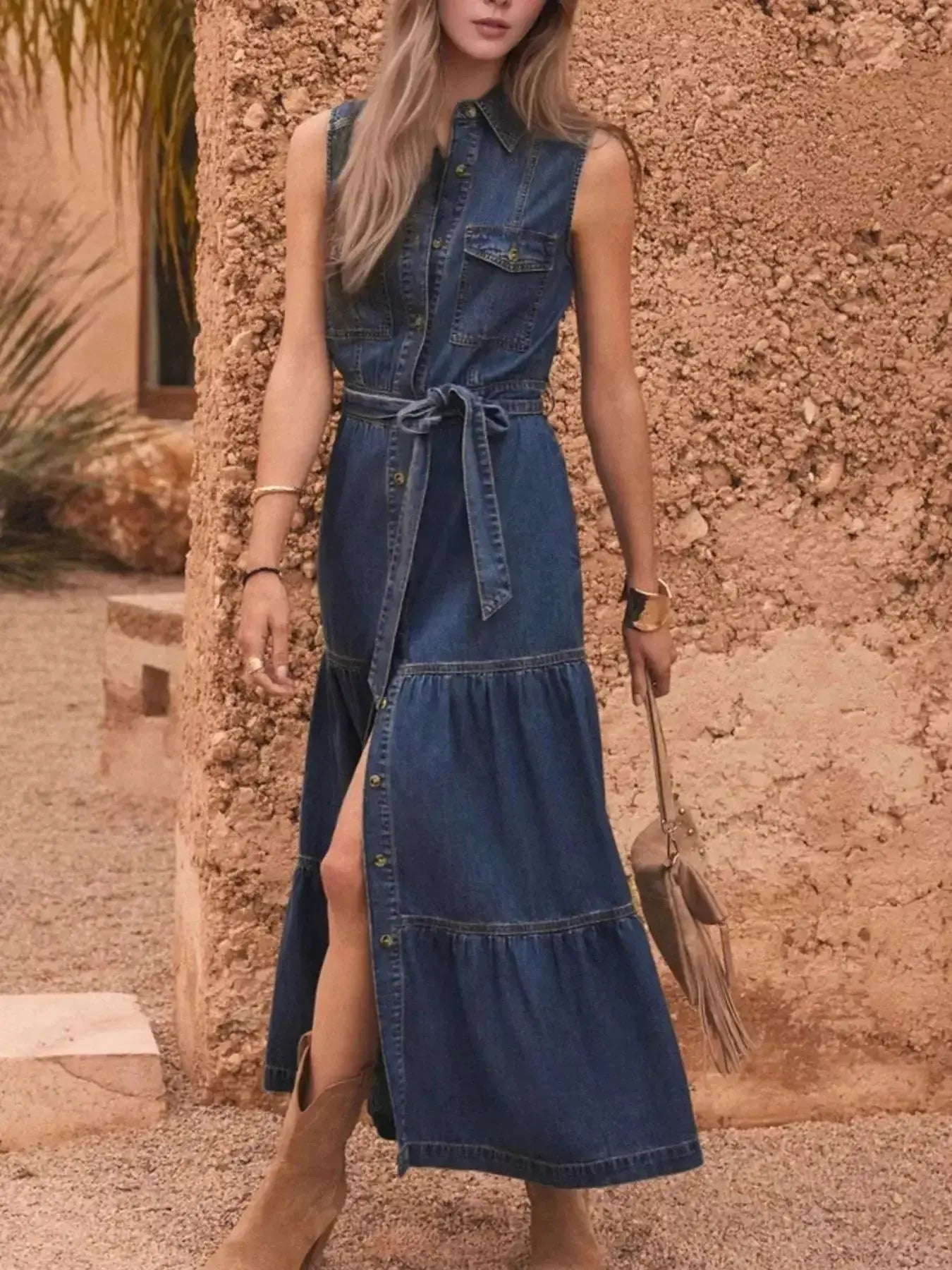 Sleeveless denim dress with button front and tiered design, featuring a belt for a stylish look from Trendsi.