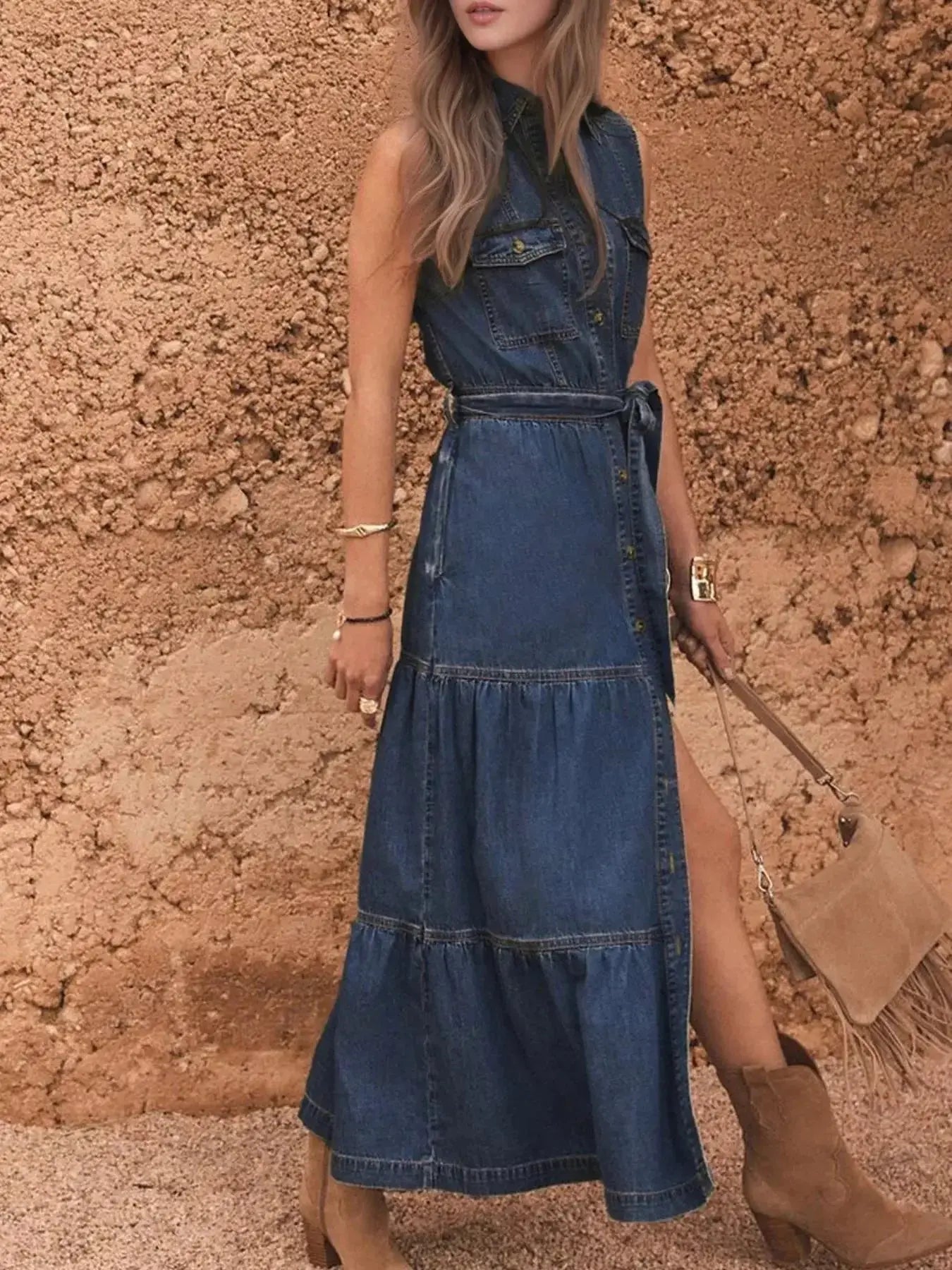 Sleeveless denim dress with button-front closure, tiered design, and waist belt by Trendsi, casual summer style.