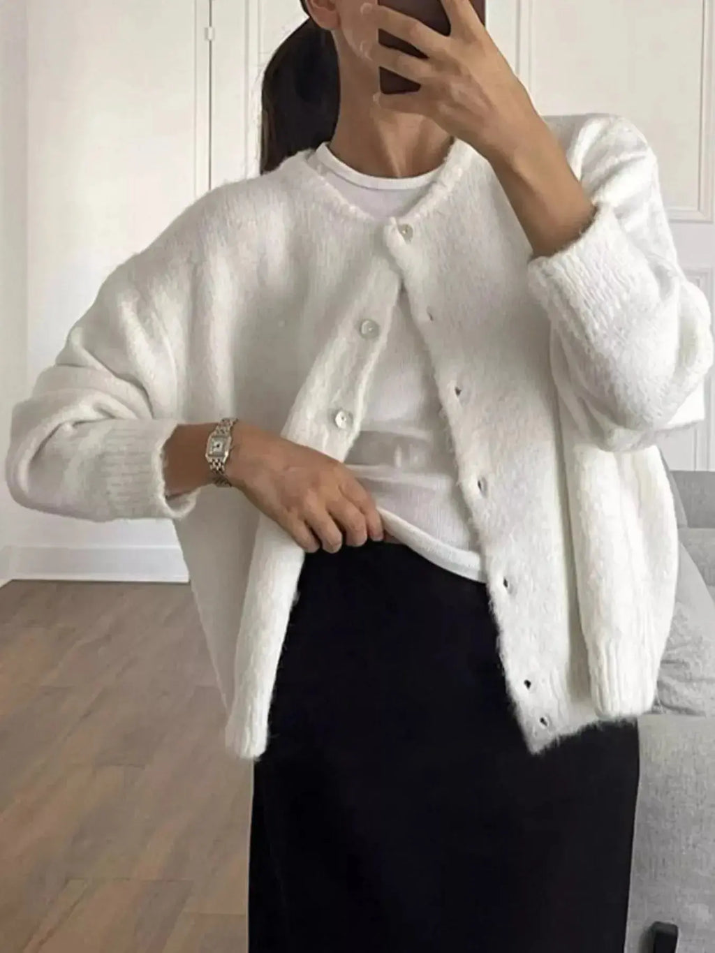 Soft knit long sleeve button-up cardigan by Plush Fashion Hub, featuring a classic design and cozy layering style.