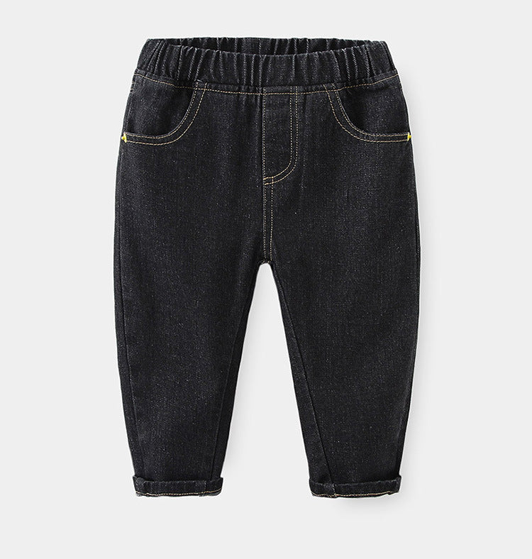 Dark charcoal denim jeans with elastic waistband, yellow stitching, scoop pockets, and rolled-up cuffs.