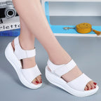 White genuine leather platform sandals with open toes and adjustable hook-and-loop velcro straps.