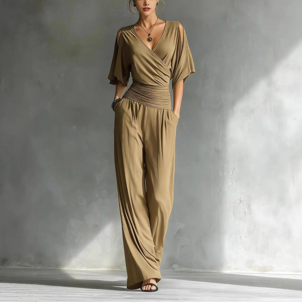 Women's V-neck slim fit straight leg jumpsuit by Plush Fashion Hub, shown in black with fitted waist and full-length legs.