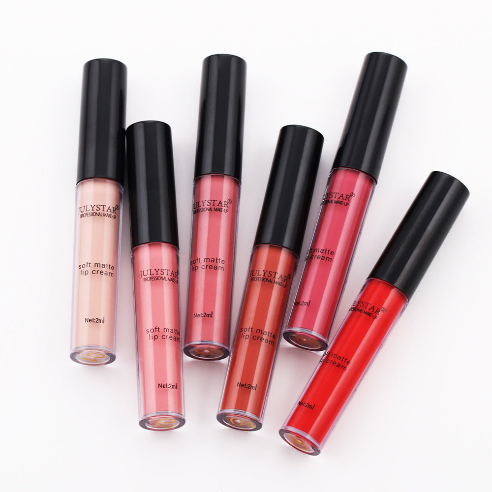 Six Julystar soft matte lip cream tubes in varied shades of pink, peach, and red, with black caps.