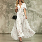 Women's deep V-neck ruffle sleeve printed maxi dress by FitiqueFit, featuring high waist and flowing fabric.